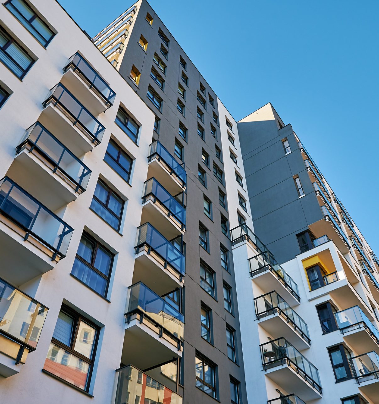 Modern apartment building with balconies.